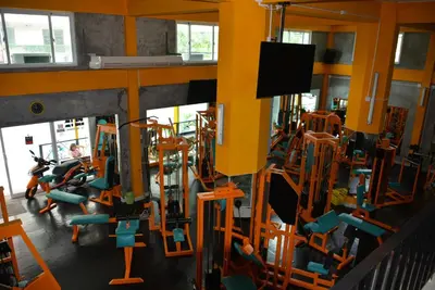 a gym with a bunch of tread machines at Prestige Pool Villa by Karon Homes in Karon Beach