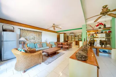 a living room with a couch and a table at Unique Style 3BR Apartment BGV 216 in Gated Residence, Kata in Kata Beach