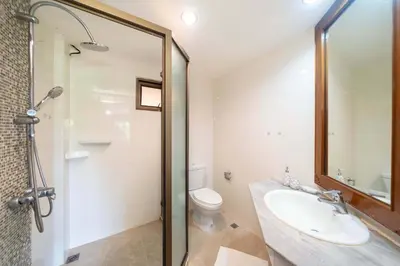 a bathroom with a sink and a toilet and a shower at Unique Style 3BR Apartment BGV 216 in Gated Residence, Kata in Kata Beach