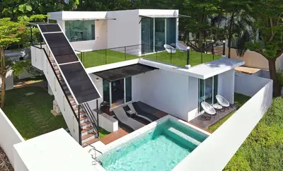 an aerial view of a house with a swimming pool at Nariya Bayfront Phuket in Chalong