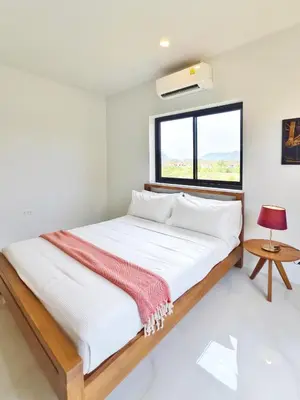 a bed in a white room with a window at Krabi Private Pool Villa 1 by Belcarrra Spaces in Ban Khlong Haeng