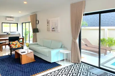 a living room with a couch and a table at Krabi Private Pool Villa 1 by Belcarrra Spaces in Ban Khlong Haeng
