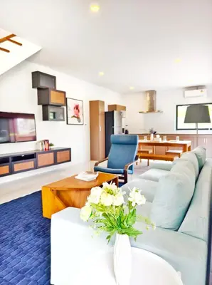 a living room with a couch and a table at Krabi Private Pool Villa 1 by Belcarrra Spaces in Ban Khlong Haeng