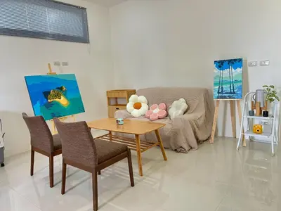 a living room with a couch and a table at JK Studio, Koh Yao Noi in Ko Yao Noi