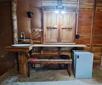 a bathroom with a sink and a counter with a sink at Big Hug Home - Sa med kaw in Ban Takhrai