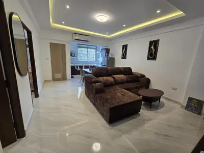 a living room with a couch and a table at Yuya's sweet Condo suite in Patong Beach
