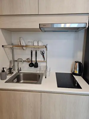 a kitchen with a sink and a counter with utensils at The Viva Patong Condo - 1Bdr - 35sqm Studio - Patong Hills in Patong Beach