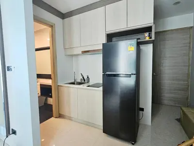 a stainless steel refrigerator in a kitchen with a sink at The Viva Patong Condo - 1Bdr - 35sqm Studio - Patong Hills in Patong Beach