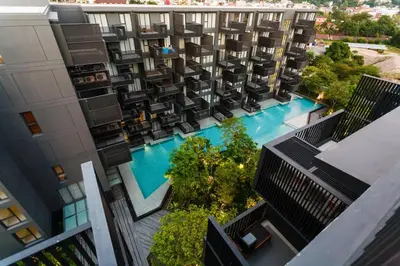 an overhead view of a building with a swimming pool at Deck Condo private apartment by Lofty in Patong Beach