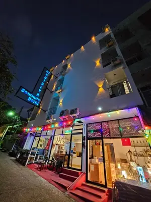a store front of a building at night at 07 Antalya Boutique Hotel in Patong Beach