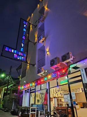 a building with lights on the side of it at 07 Antalya Boutique Hotel in Patong Beach