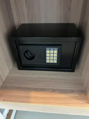 a microwave oven in the corner of a room at 07 Antalya Boutique Hotel in Patong Beach