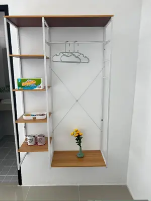 a cupboard with a shelf and a hanger at 07 Antalya Boutique Hotel in Patong Beach