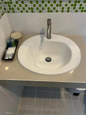 a white sink in a bathroom with a counter at 07 Antalya Boutique Hotel in Patong Beach