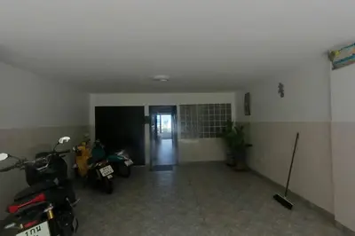 a hallway with motorcycles parked in a room at Eagles Nest Patong in Patong Beach