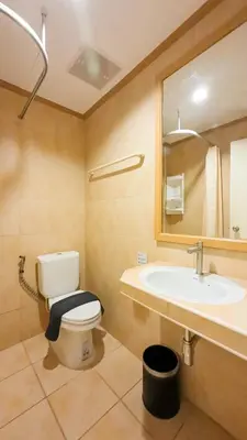 a bathroom with a toilet and a sink at JB House Patong in Patong Beach