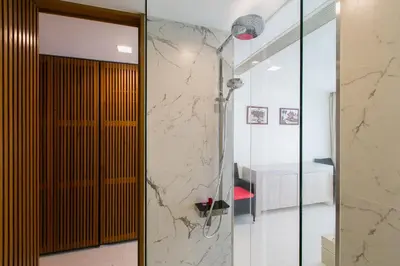 a bathroom with a shower with a glass door at The Heights Penthouse A5 3Bedrooms Seaview near Kata Beach in Kata Beach