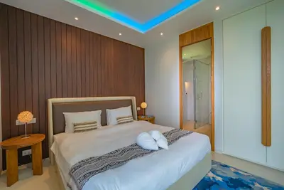 a bedroom with a large bed with white sheets at Luxury Pool Villa in Nai Harn - Villa Solana in Rawai Beach