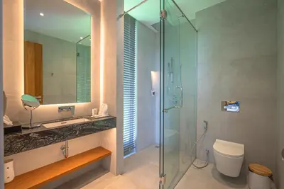 a bathroom with a shower and a toilet and a sink at Luxury Pool Villa in Nai Harn - Villa Solana in Rawai Beach