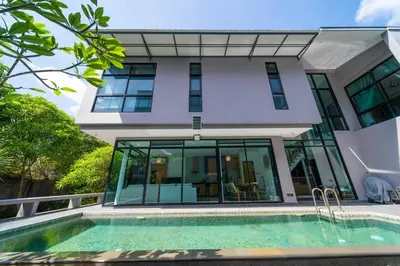 a house with a swimming pool in front of it at BangT-ao 3-bedroom modern minimalist luxury style private pool holiday villa gym quiet community in Bang Tao Beach