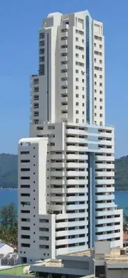 a tall white building with many windows at Patong Tower Dream Sea View Apartment in Patong Beach