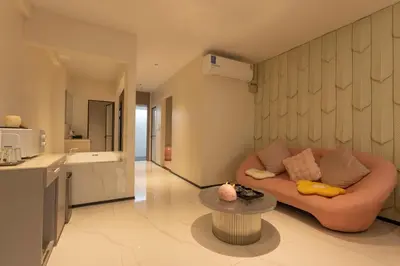 a living room with a couch and a table at YUSU Hotel \u7fbd\u5bbf\u9152\u5e97 in Phuket Town