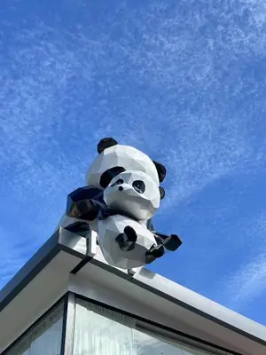a sculpture of a panda bear on top of a building at YUSU Hotel \u7fbd\u5bbf\u9152\u5e97 in Phuket Town