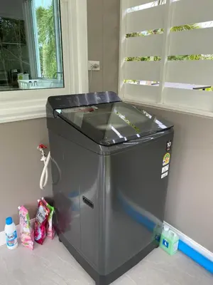 a small refrigerator in a room with a window at Green Tree Cottage5 in Klong Muang Beach