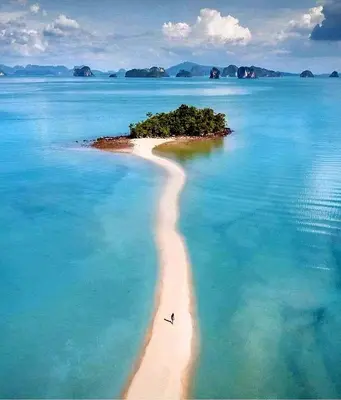 a bird flying over a small island in the ocean at House On The Bay2, Koh Yao in Ko Yao Noi