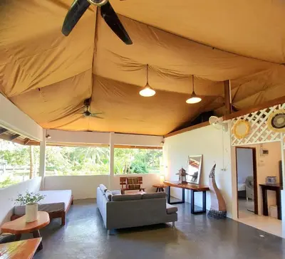 a living room with a couch and a ceiling at House On The Bay2, Koh Yao in Ko Yao Noi