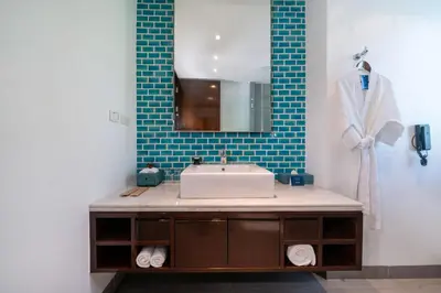 a bathroom with a sink and a mirror at Karon Beachfront Apartment 724 in Karon Beach