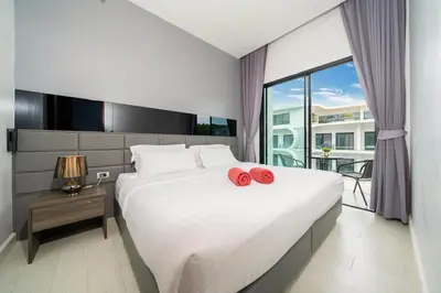 a bedroom with a large bed with red roses on it at Spacious Pool View 1BR Apartment in Utopia Naiharn Residence near Beach, UTN D604 in Rawai Beach