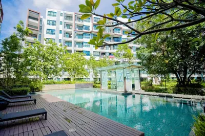 a swimming pool in front of a building at 04near Shopping Malls and Naka night market in Phuket Town