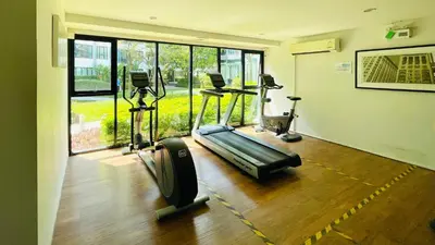 a gym with two treadmills and a treadmill at 04near Shopping Malls and Naka night market in Phuket Town