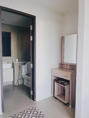 a bathroom with a toilet and a mirror at 04near Shopping Malls and Naka night market in Phuket Town