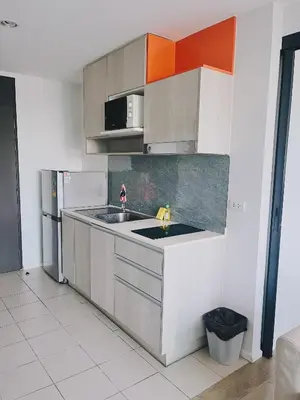 a kitchen with a sink and a refrigerator at 04near Shopping Malls and Naka night market in Phuket Town
