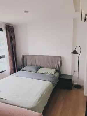 a bed in a small room with a lamp at 47near Shopping Malls and Naka night market in Phuket Town