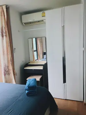 a bedroom with a bed and a mirror at 47near Shopping Malls and Naka night market in Phuket Town