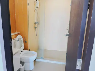 a small bathroom with a toilet and a shower at 47near Shopping Malls and Naka night market in Phuket Town