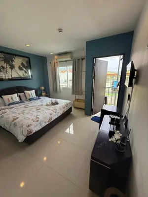 a large bedroom with a bed and a mirror at DANK Hotel 420 friendly Patong Phuket in Patong Beach