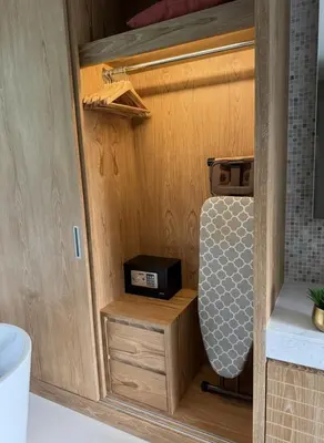 a small kitchen with a stove in a tiny house at Luxury 3BR Pool Villa near Blue Tree - Bang Tao in Amphoe Kathu