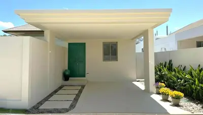 a front door of a house with a green door at Luxury 3BR Pool Villa near Blue Tree - Bang Tao in Amphoe Kathu