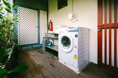 a washer and dryer sitting in a room at O'nya Phuket Hotel in Phuket Town