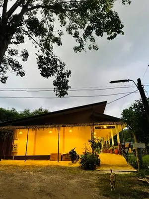 a house with a yellow facade at Cuckoo's Nest Ao Nang in Ban Khlong Son