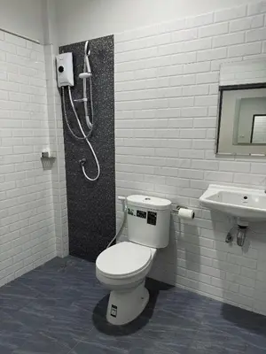 a bathroom with a toilet and a sink at Cuckoo's Nest Ao Nang in Ban Khlong Son