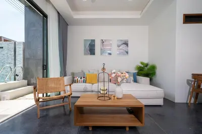 a living room with a couch and a table at Stylish Pool Villa in Chalong-Phuket-2 Bedroom in Ban Suan