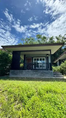 a small house with a porch and a lawn at Picha house Kohyaonoi in Ban Laem Sai