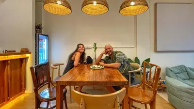 a man and a woman sitting at a table at Purr in Phuket Town