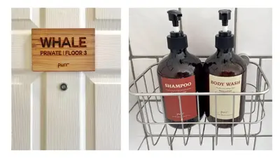 two bottles of wine in a basket next to a wooden sign at Purr in Phuket Town