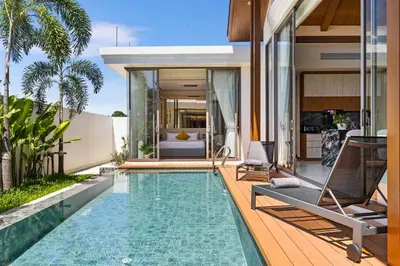 a house with a swimming pool and a villa at The Ozon Bangtao 3-bedrooms Villas with pool by My Home Phuket in Laguna Phuket